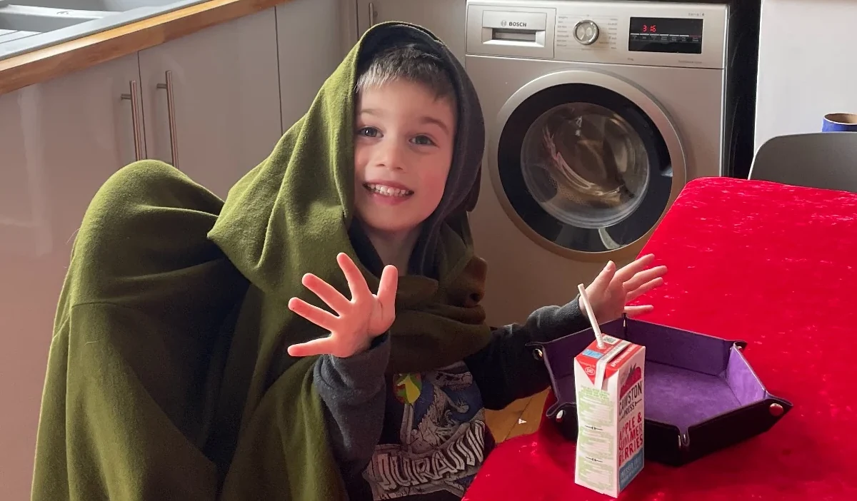 Young Pioneer taking an expressive leading role at the table